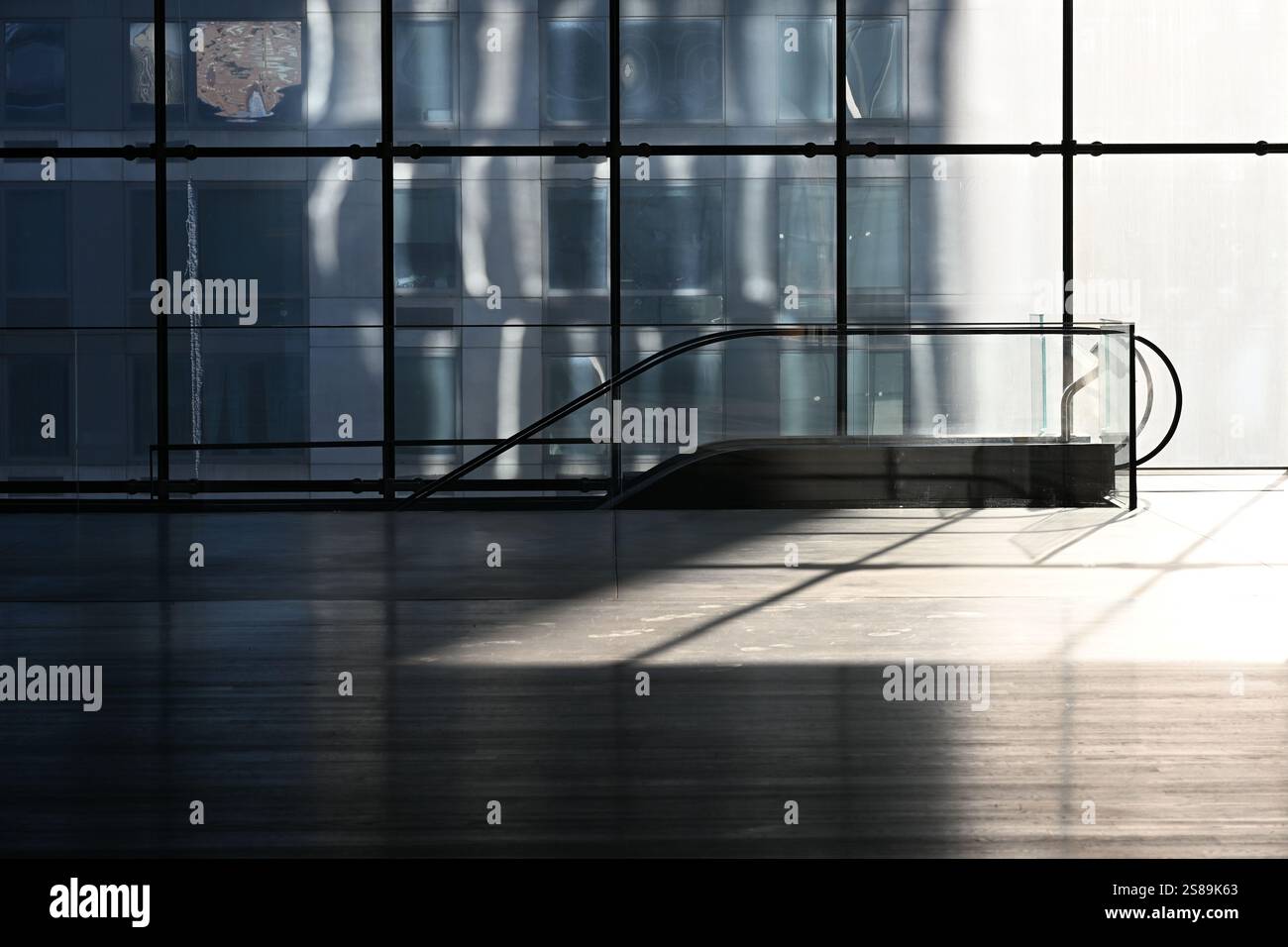 empty office building space with down escalator Stock Photo