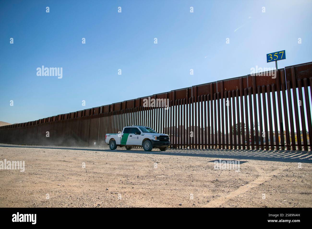 A Border Patrol truck rides along the border wall in Sunland Park, N.M ...
