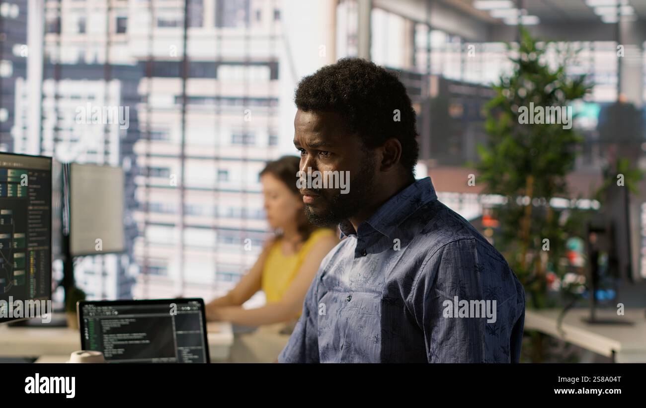 Data scientist developing and maintaining machine learning APIs solving complex problems. Man training predictive models capable of handling tasks such as language processing, camera A Stock Photo