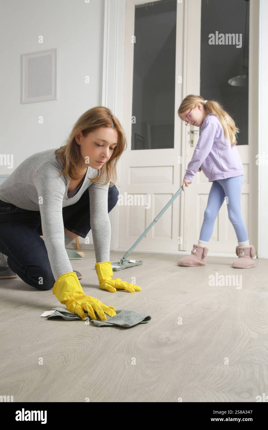 Mother and daughter do the cleaning in the house. Including chores in a ...