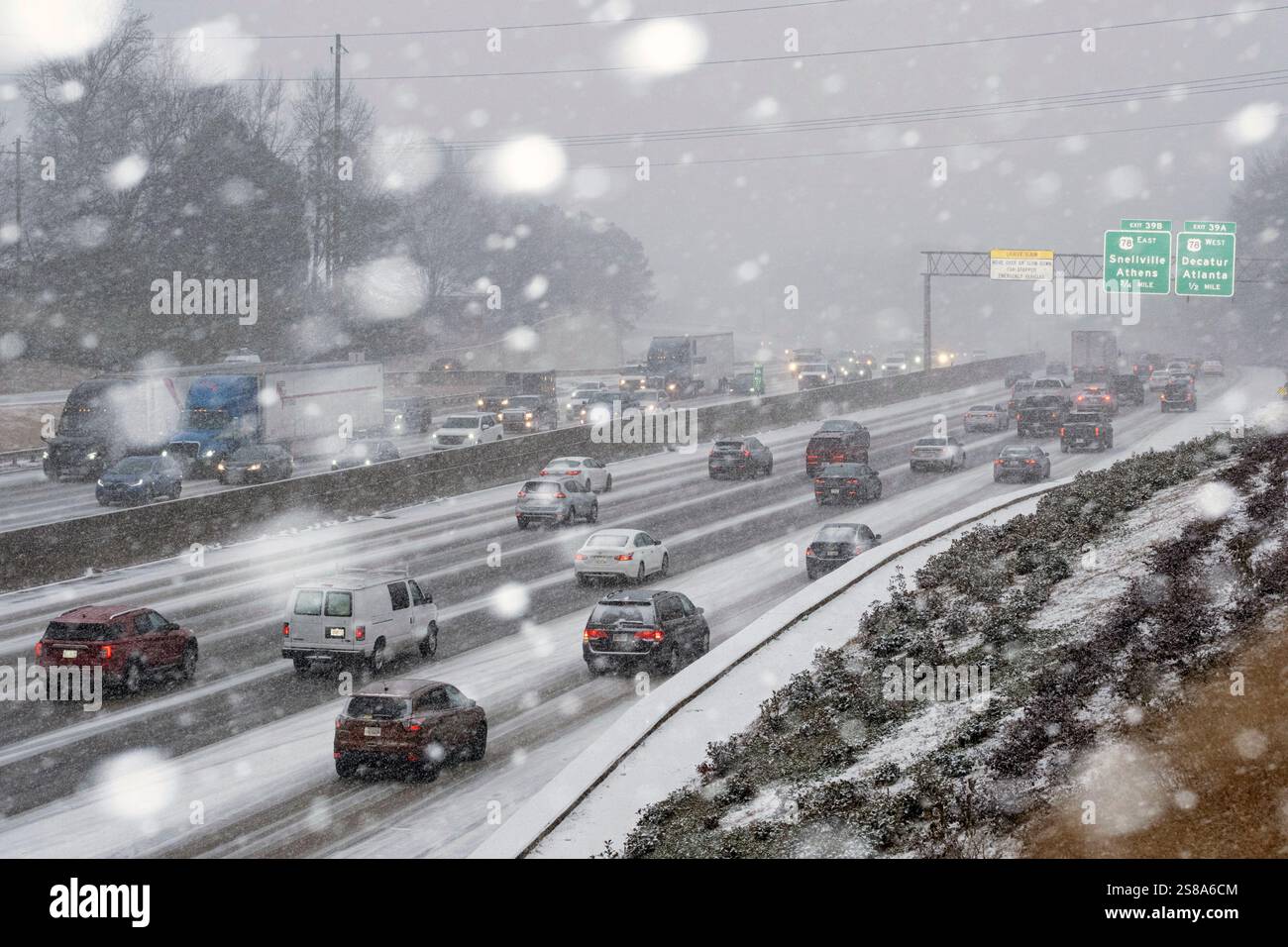 Snow begins to stick on I285 in Tucker, Ga., as a winter storm brings