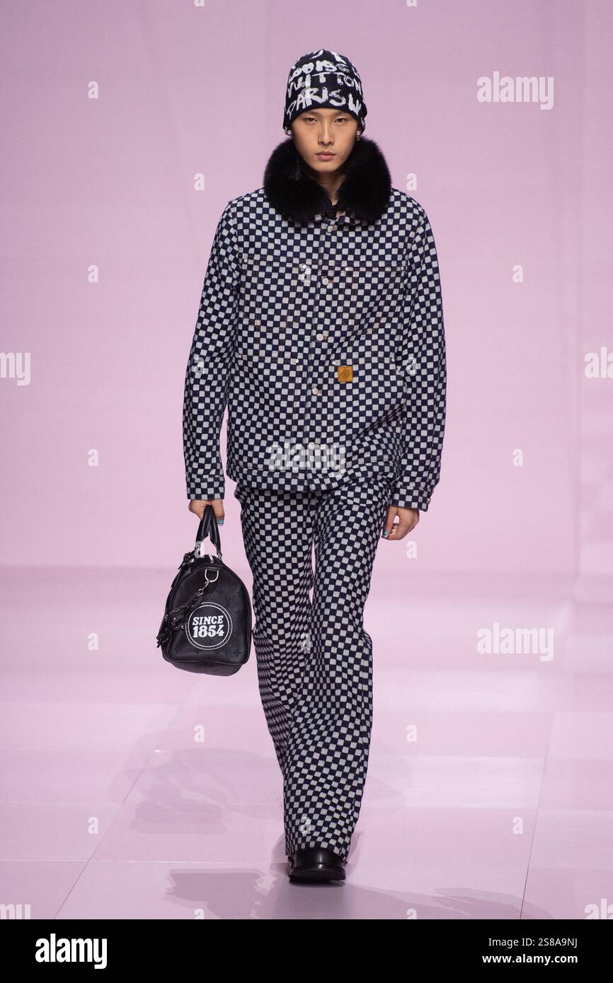 A model walks the runway during the Louis Vuitton Menswear FallWinter