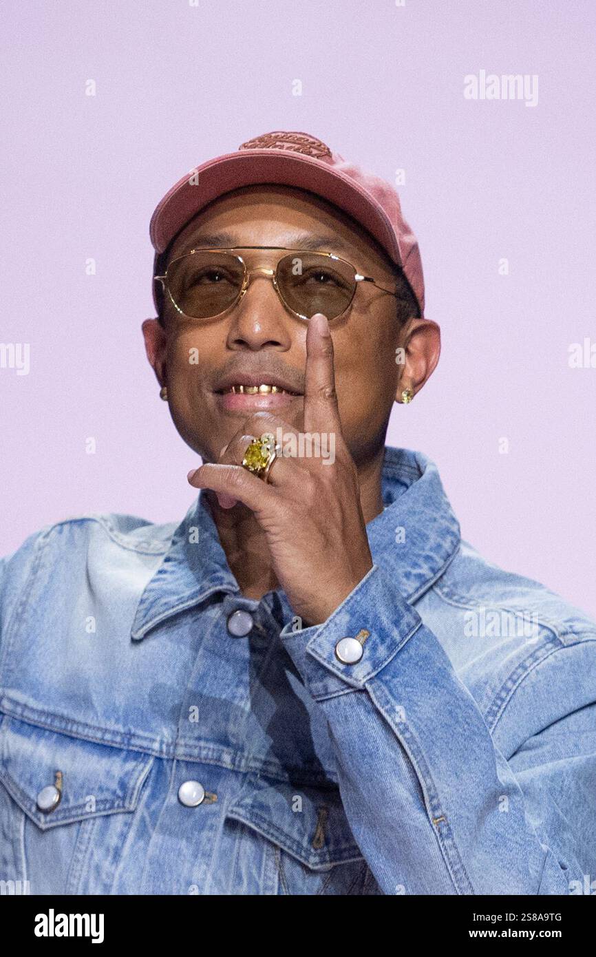 Designer Pharrell Williams makes an appearance on the runway during the
