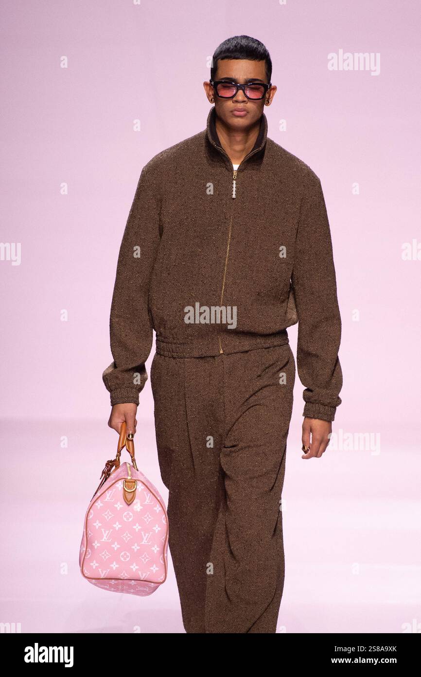 A model walks the runway during the Louis Vuitton Menswear FallWinter