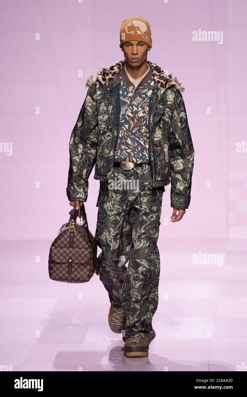 A model walks the runway during the Louis Vuitton Menswear FallWinter