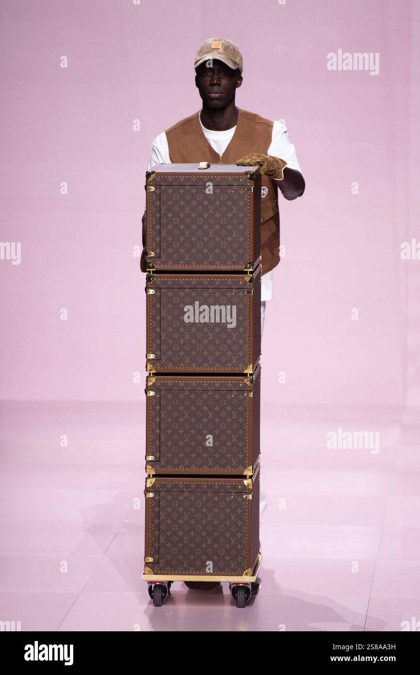 A model walks the runway during the Louis Vuitton Menswear FallWinter