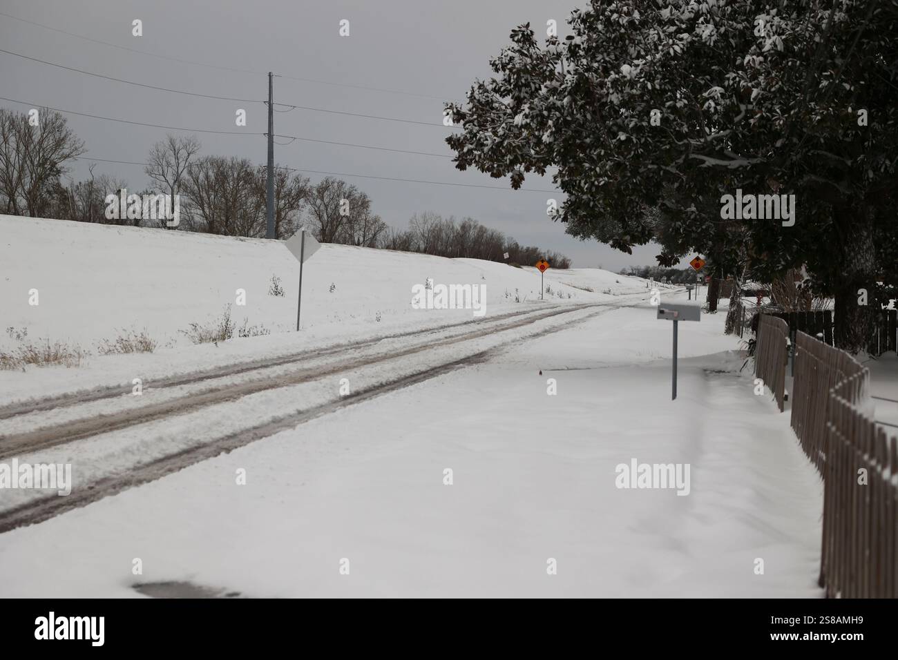 Snowfall from Winter Storm Enzo cover the levee and River Road on