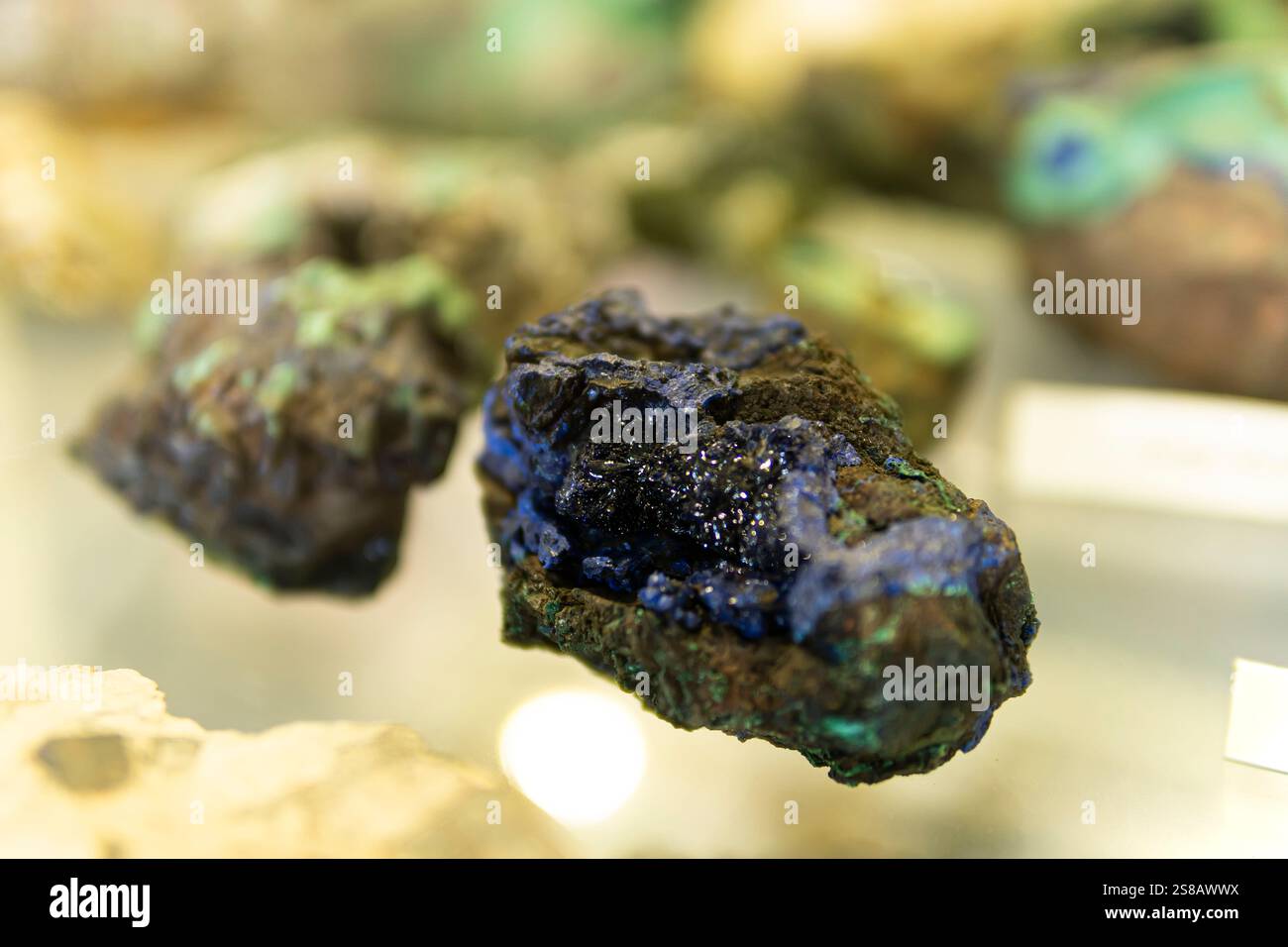 Lapis lazuli blue gemstone on a glass shelf Stock Photo