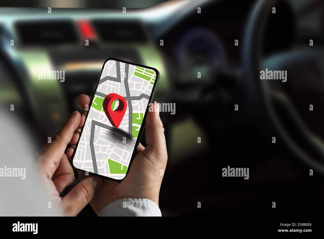 gps map ,man using a smartphone displaying a map in a car gps navigation system Stock Photo