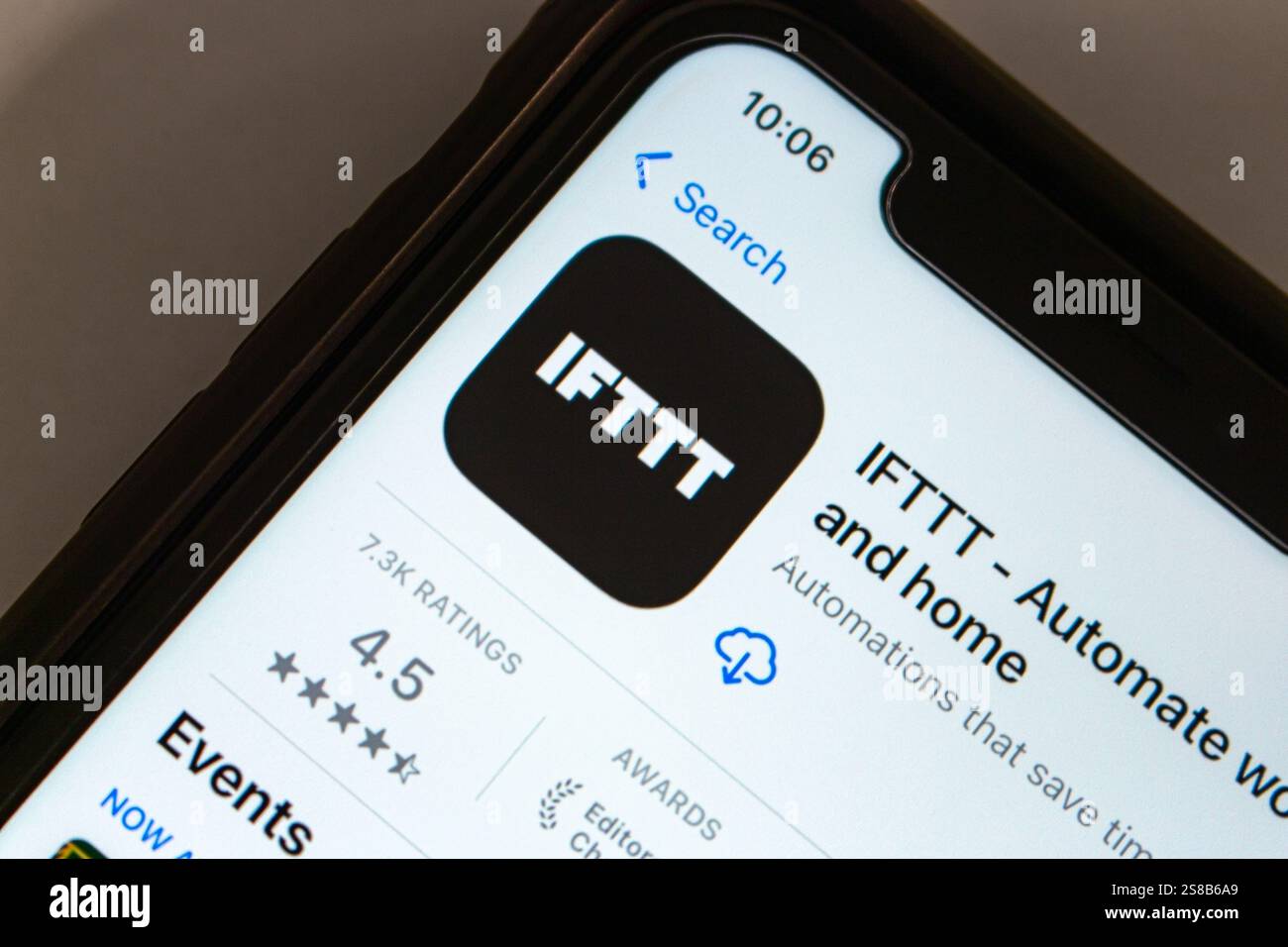 IFTTT app is displayed on App Store. IFTTT (acronym of If This Then That) is a tool that connects various apps and devices to automate tasks easily Stock Photo