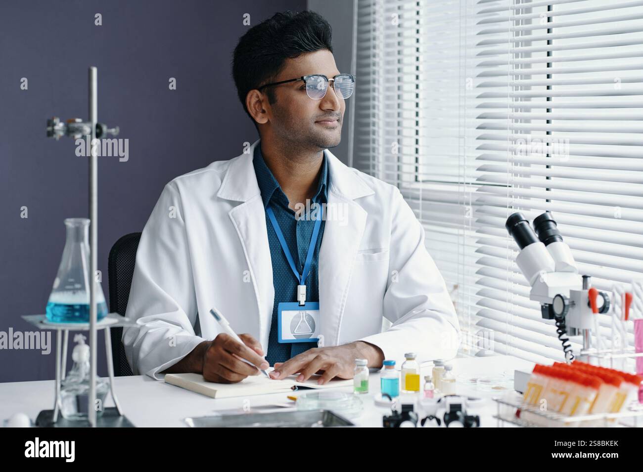 Scientist Analyzing Samples in Modern Laboratory Setting Stock Photo