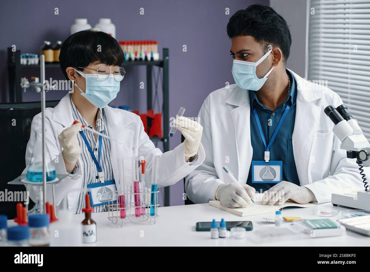 Conducting Scientific Research in Modern Laboratory Setting Stock Photo