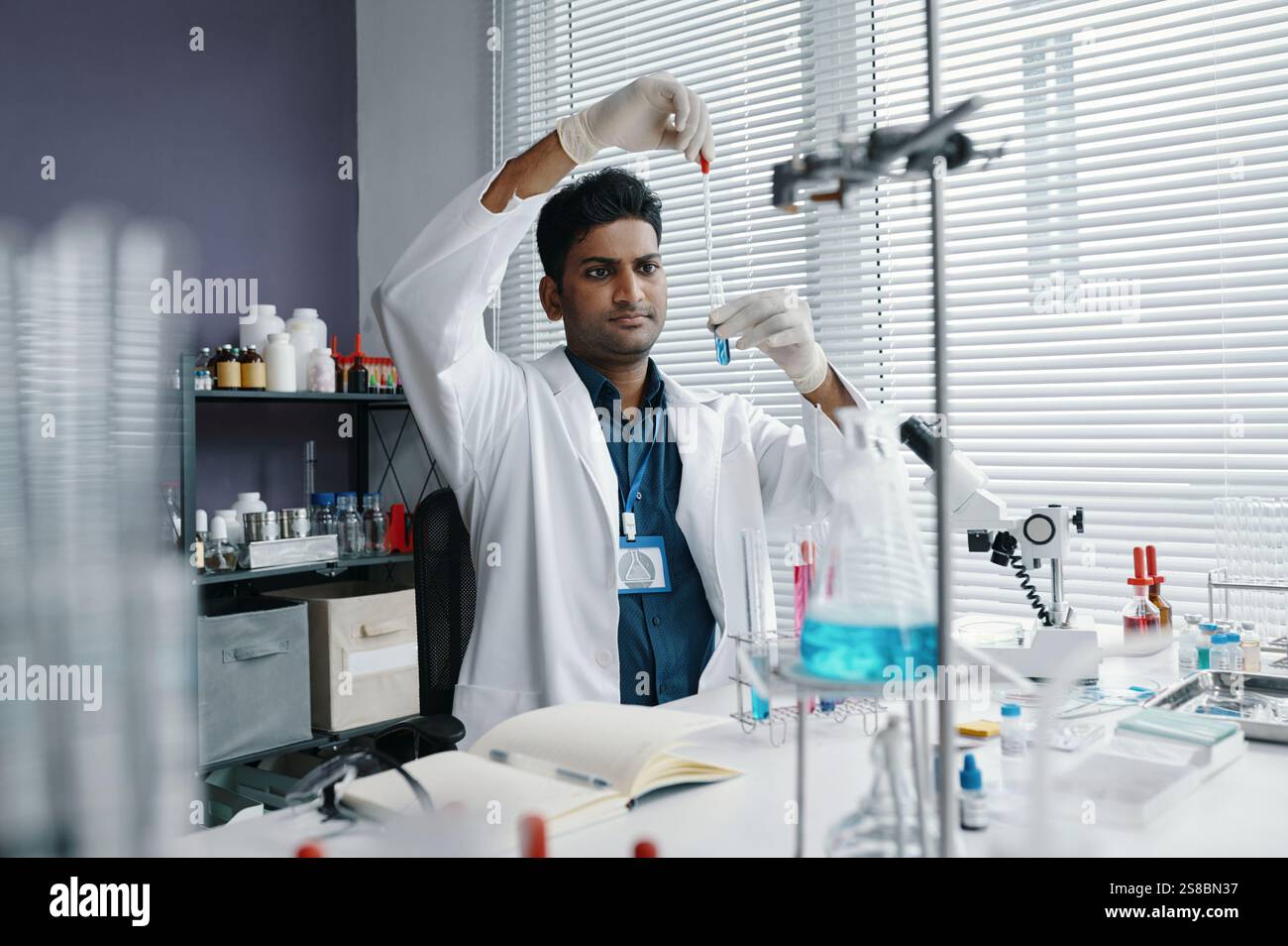 Conducting Scientific Experiments in Modern Laboratory Stock Photo