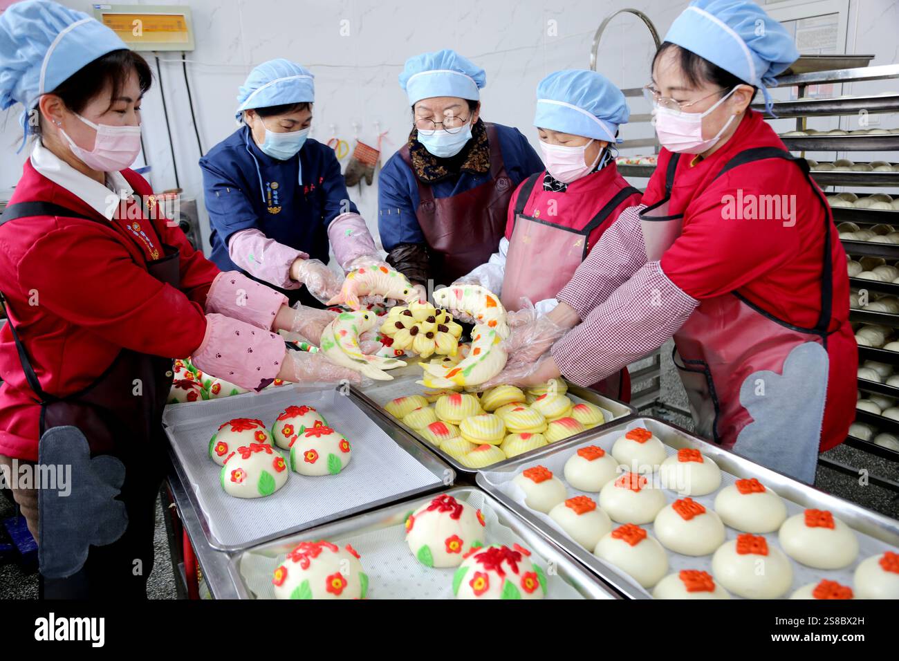 Bakers make Chinese Lunar New Year food HUAMO in Lianyungang, East