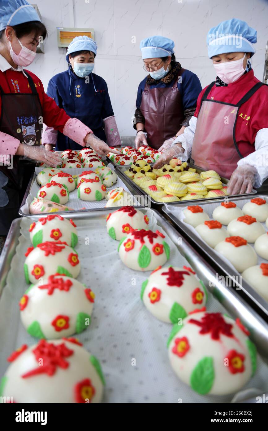 Bakers make Chinese Lunar New Year food HUAMO in Lianyungang, East