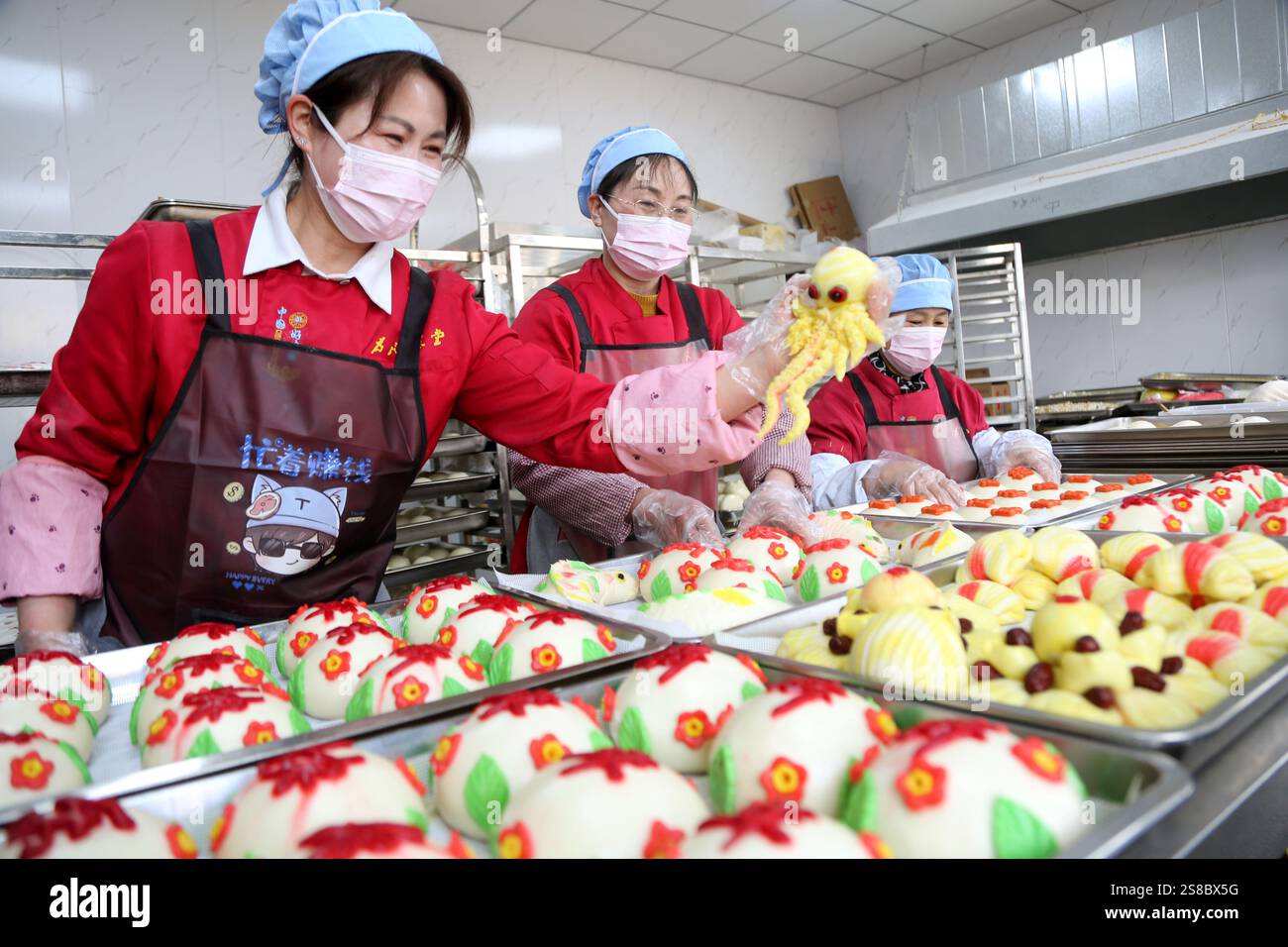 Bakers make Chinese Lunar New Year food HUAMO in Lianyungang, East