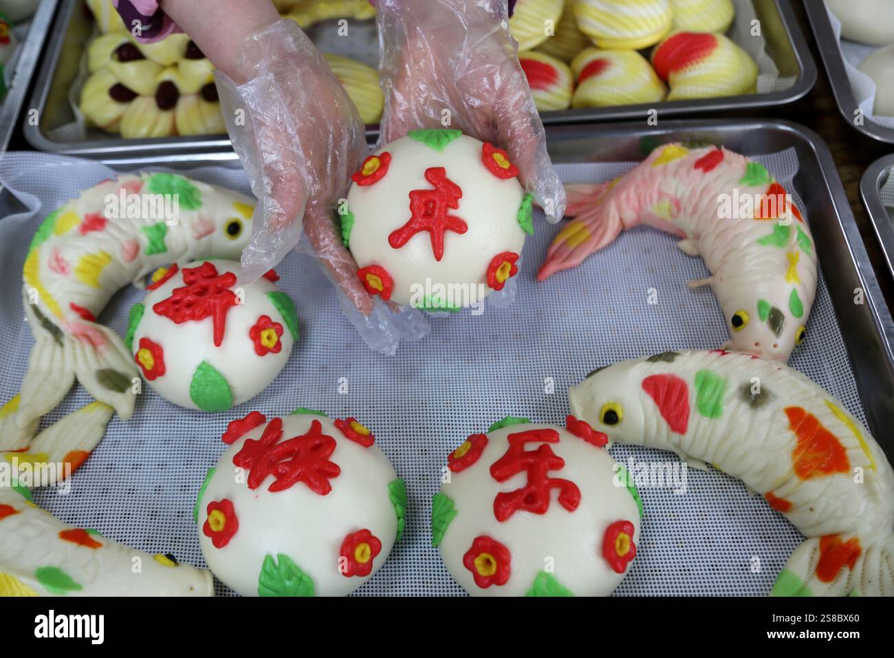 Bakers make Chinese Lunar New Year food HUAMO in Lianyungang, East