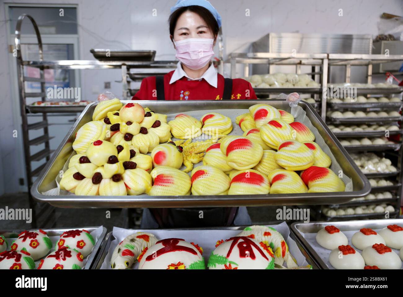 Bakers make Chinese Lunar New Year food HUAMO in Lianyungang, East