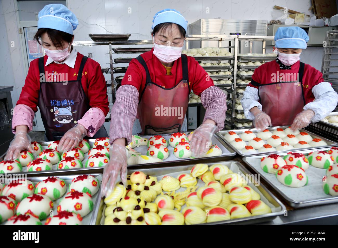 Bakers make Chinese Lunar New Year food HUAMO in Lianyungang, East