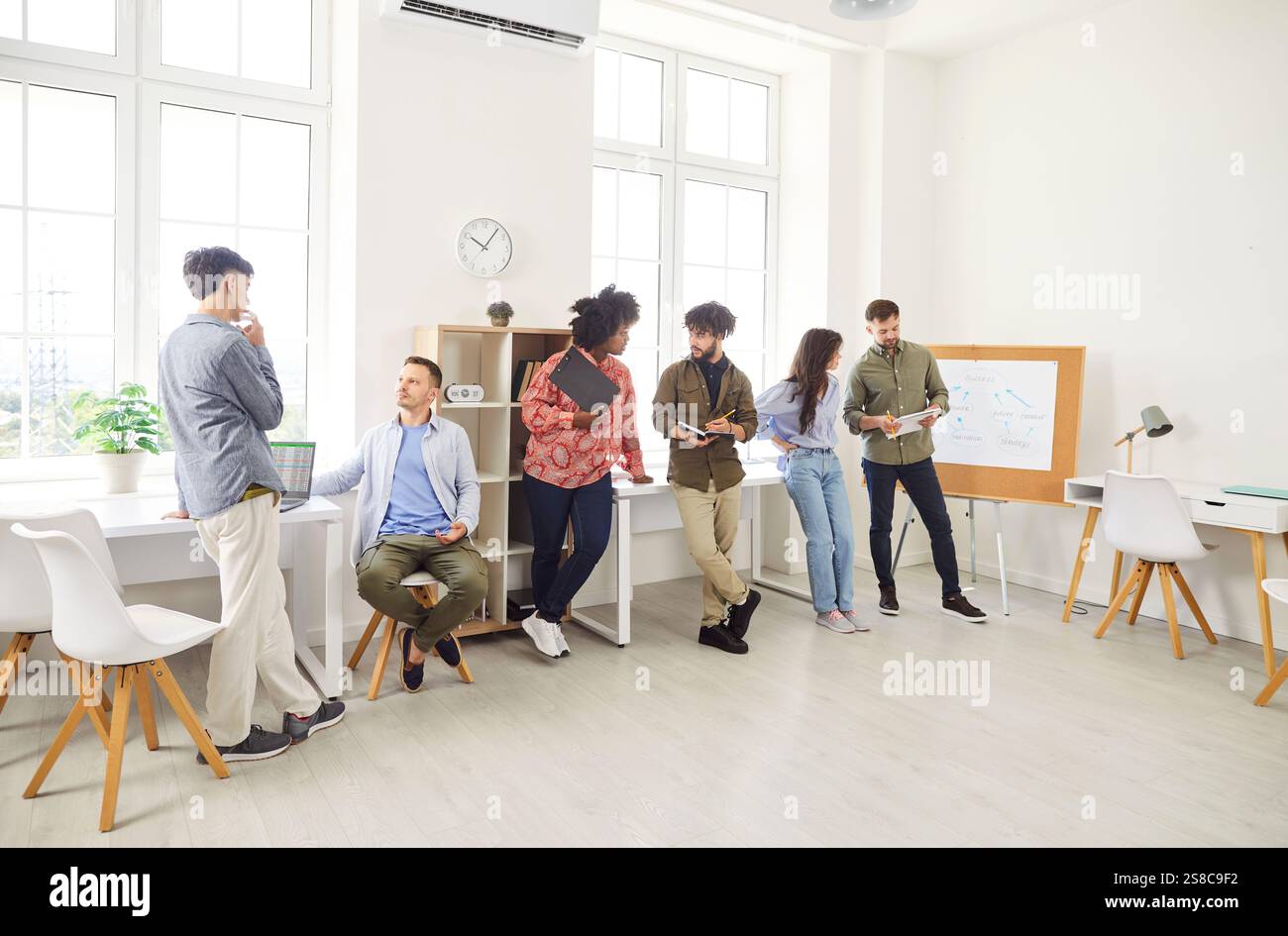 Business Team Discussing In Office During Meeting Or Training Stock Photo