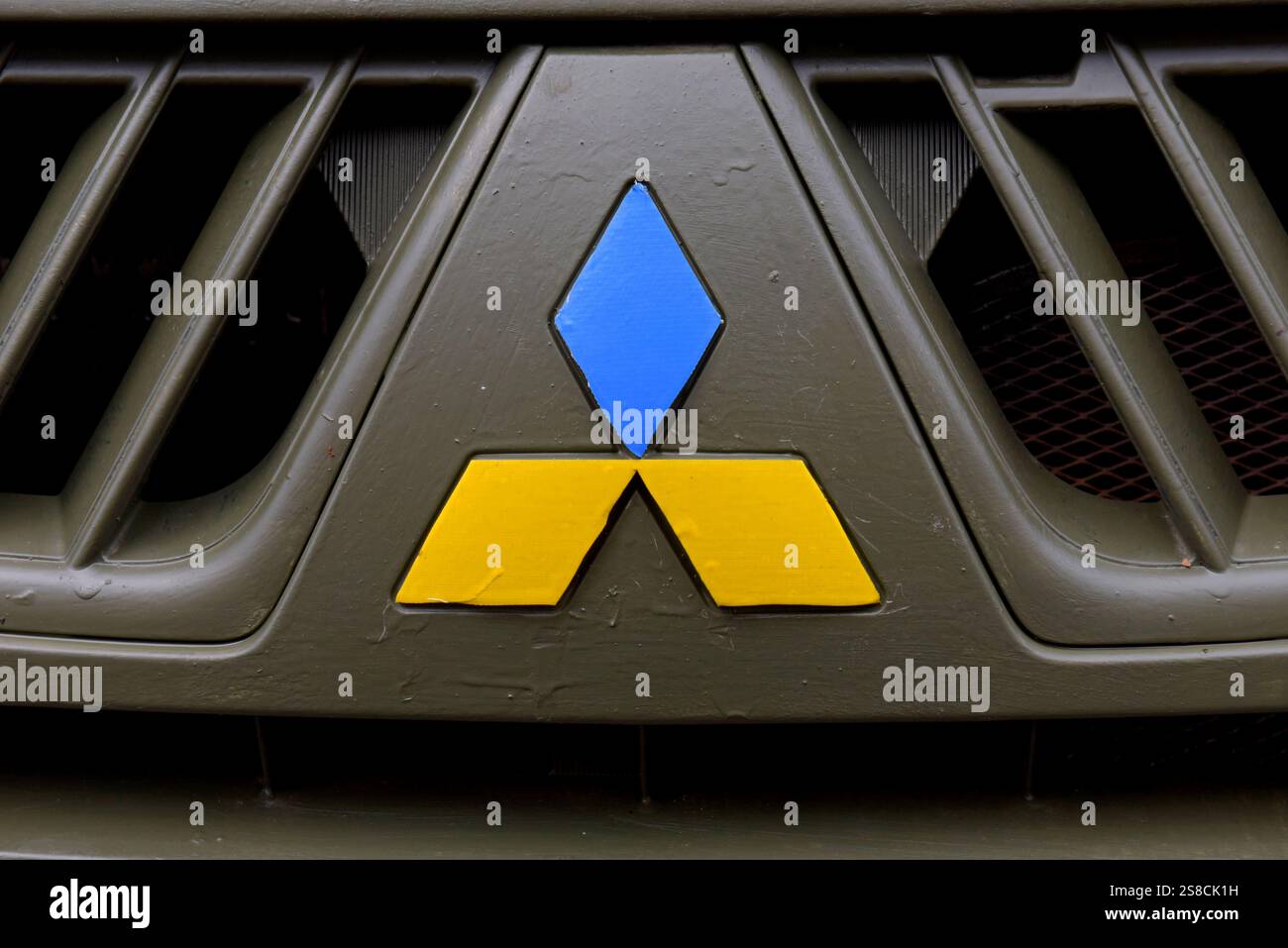 A Mitsubishi 4x4 pickup logo painted in Ukrainian flag colours arriving in  Ukraine on an aid convoy with the Pickups for Peace charity, Sept 2024 Stock Photo