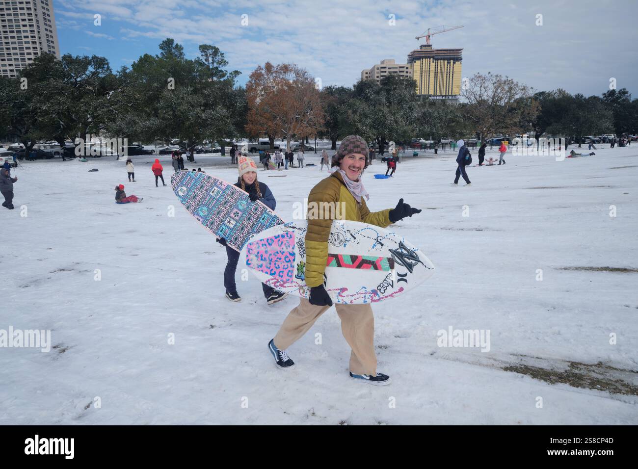 January 21, 2025, Houston, Texas, USA Residents play in the snow at