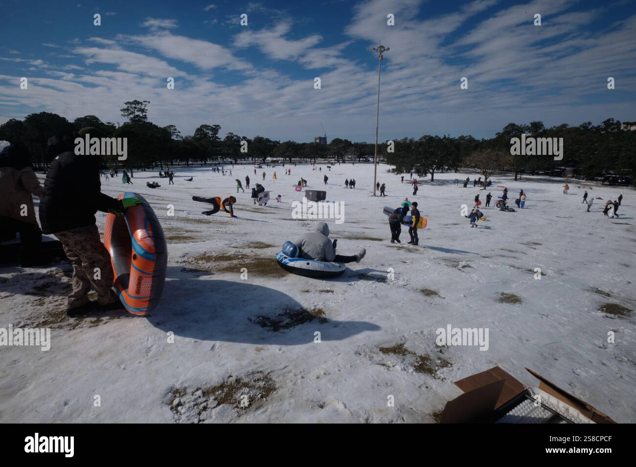 January 21, 2025, Houston, Texas, USA Residents play in the snow at