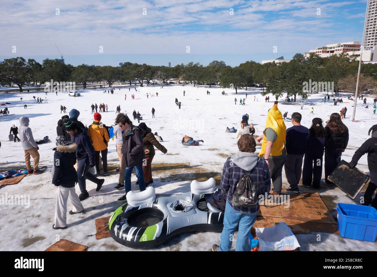 January 21, 2025, Houston, Texas, USA Residents play in the snow at