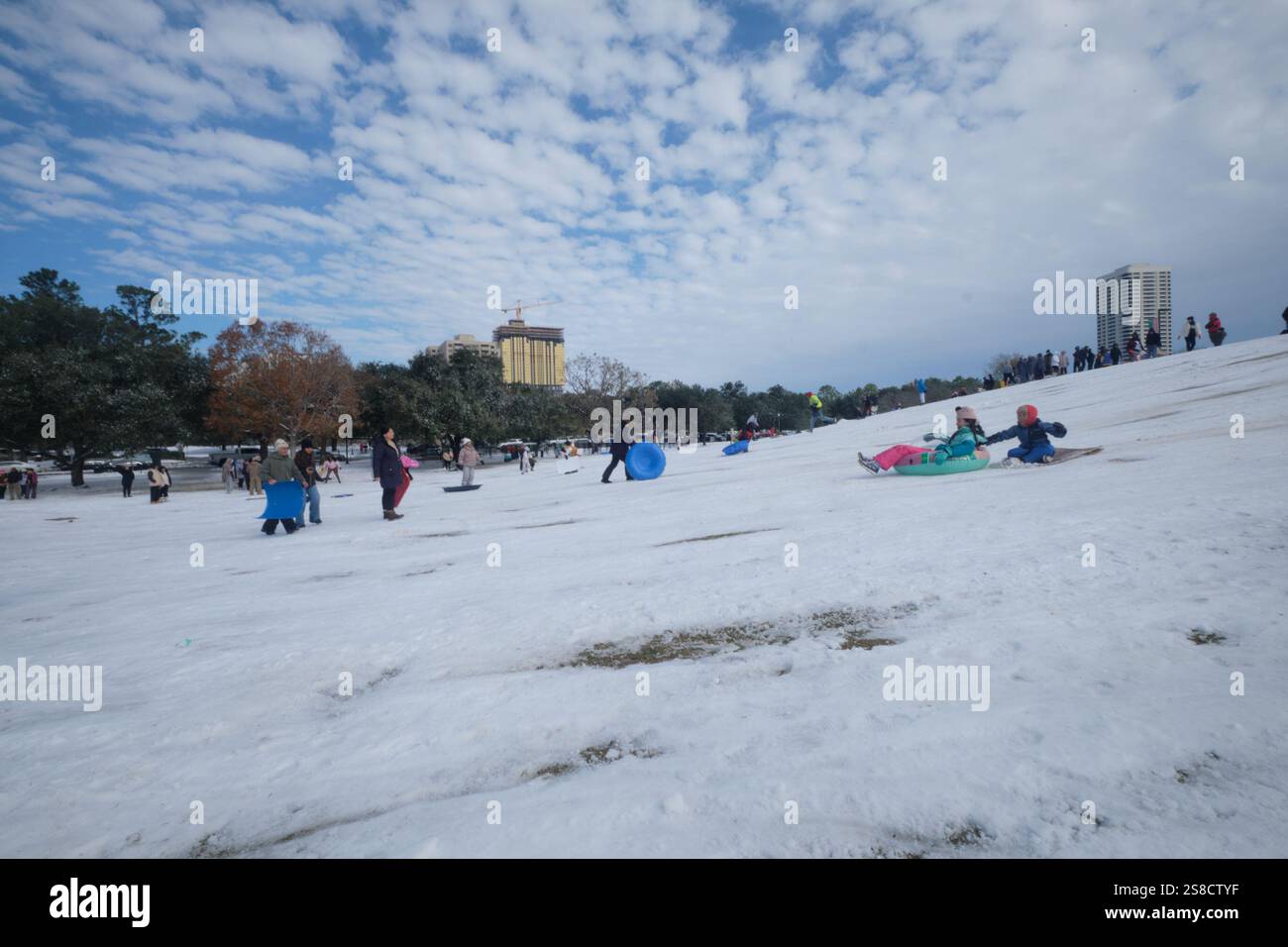 January 21, 2025, Houston, Texas, USA Residents play in the snow at