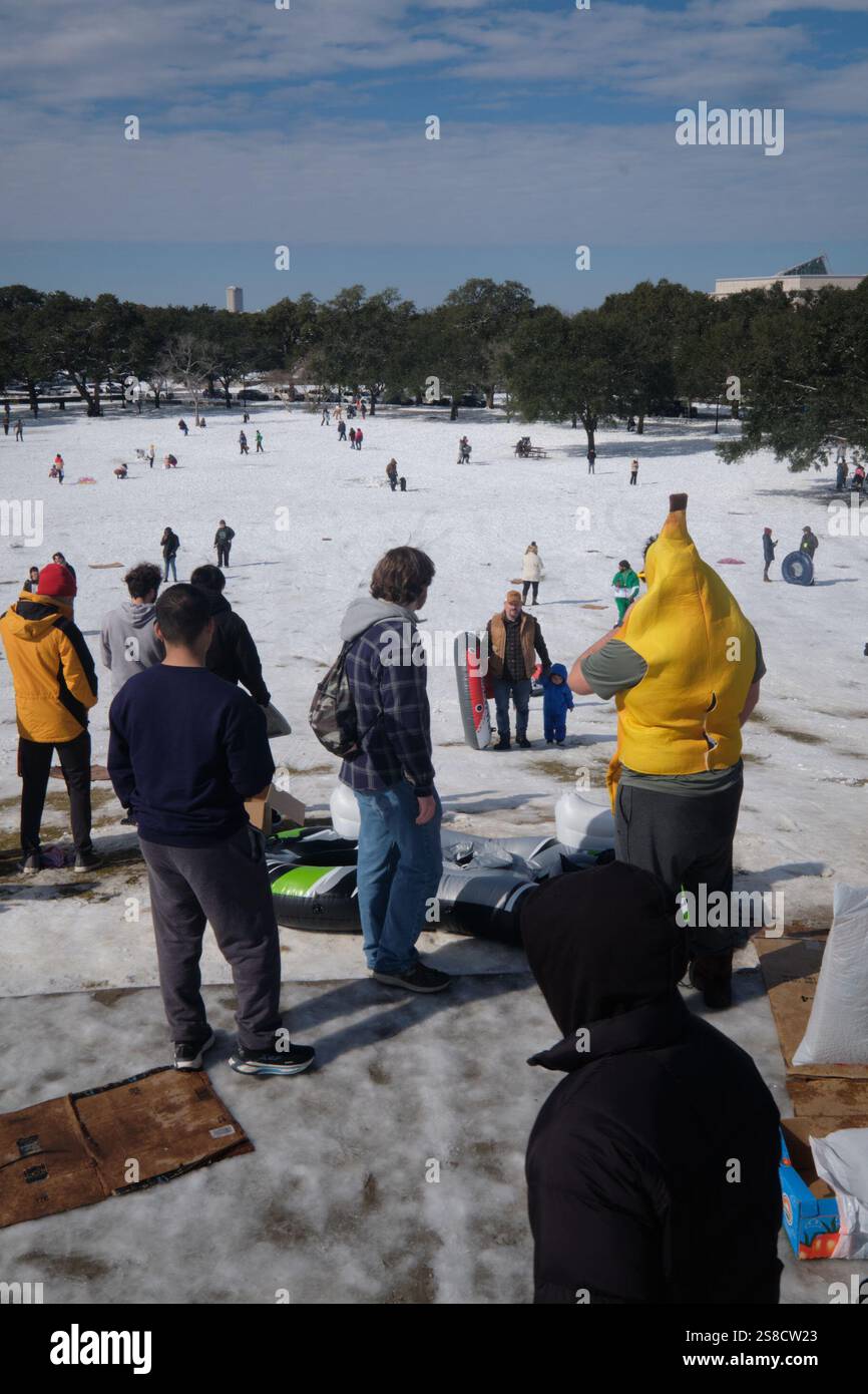January 21, 2025, Houston, Texas, USA Residents play in the snow at