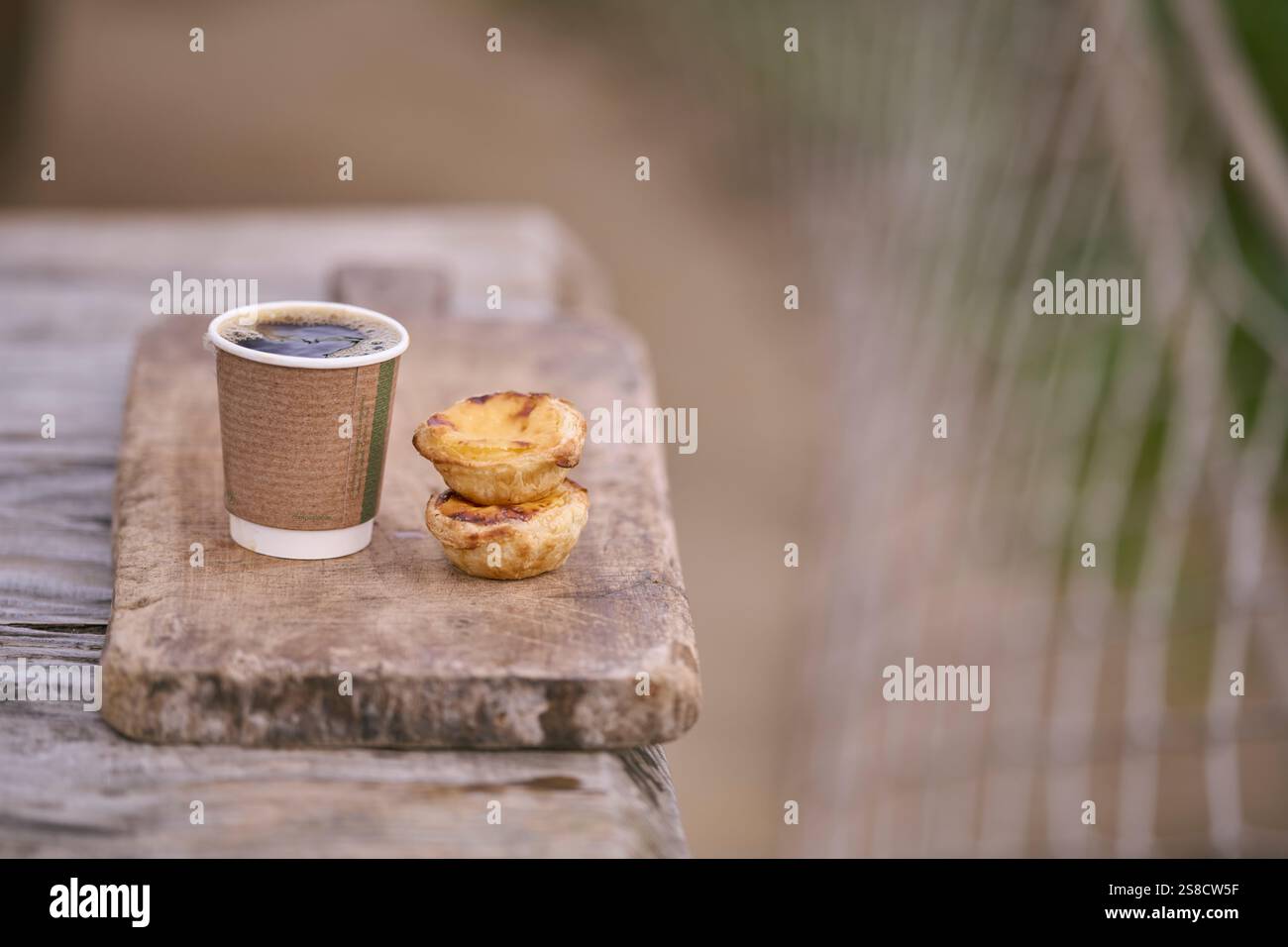 Coffee and pastry at the Hidden Hut cafe at Porthcurnick Beach, Cornwall, UK Stock Photo