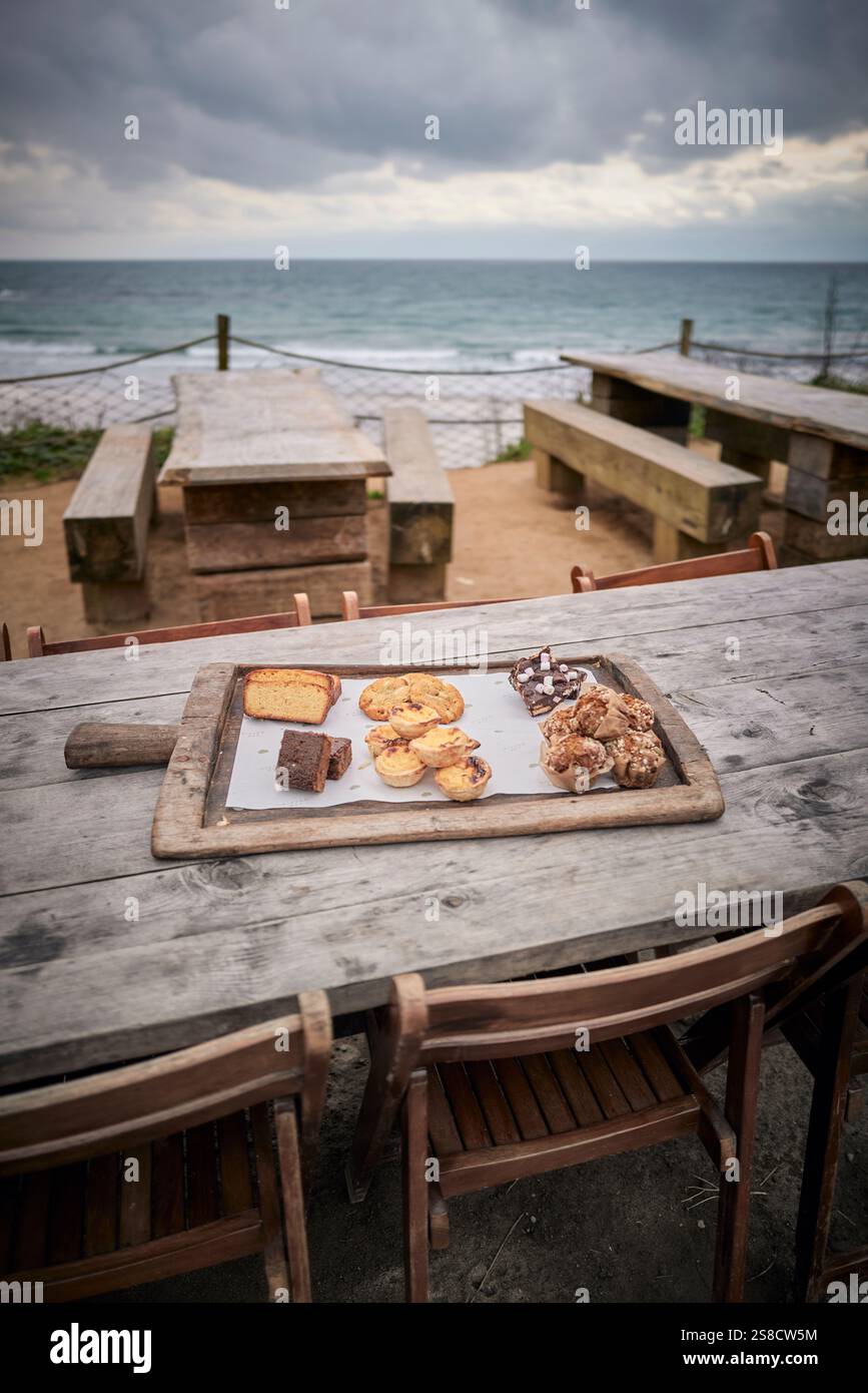 Pastries for sale at the Hidden Hut cafe at Porthcurnick Beach, Cornwall, UK Stock Photo