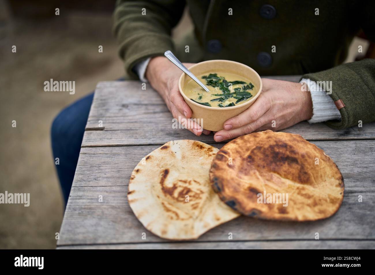 Winter celeriac and leek soup and flatbreads cooked over fire at the Hidden Hut cafe at Porthcurnick Beach, Cornwall, UK Stock Photo