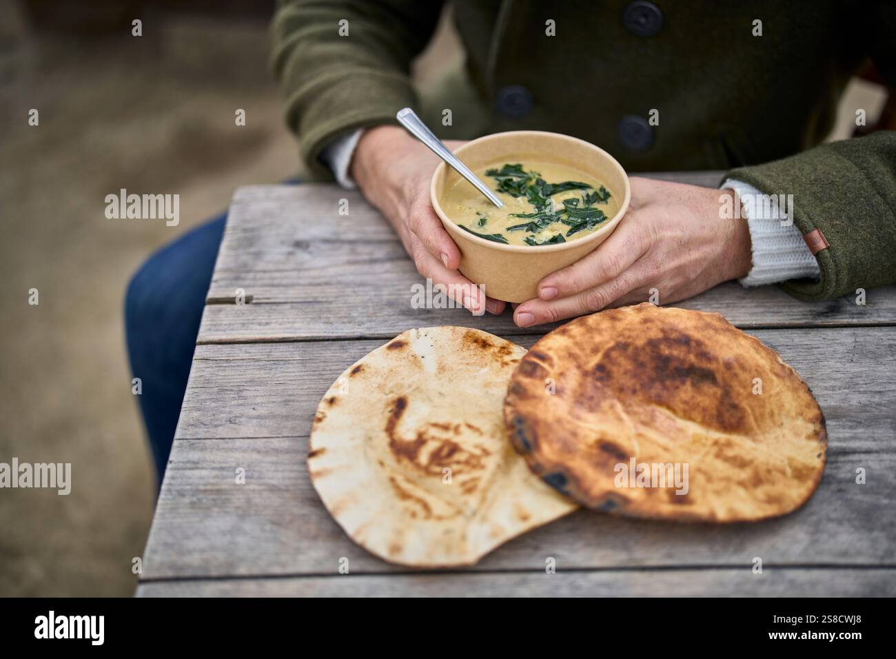 Winter celeriac and leek soup and flatbreads cooked over fire at the Hidden Hut cafe at Porthcurnick Beach, Cornwall, UK Stock Photo