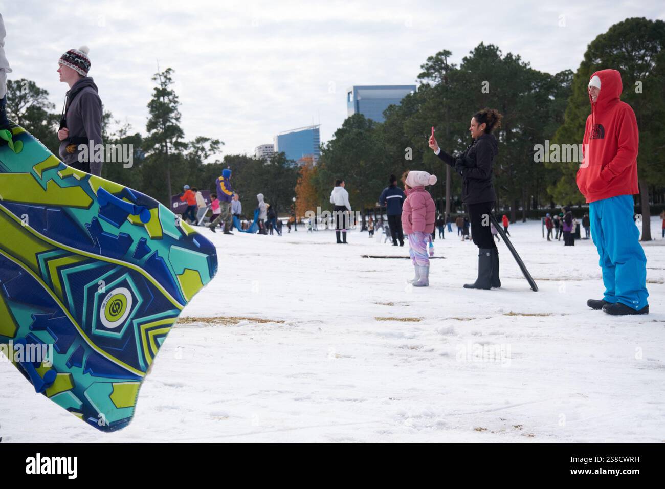 January 21, 2025, Houston, Texas, USA Residents play in the snow at