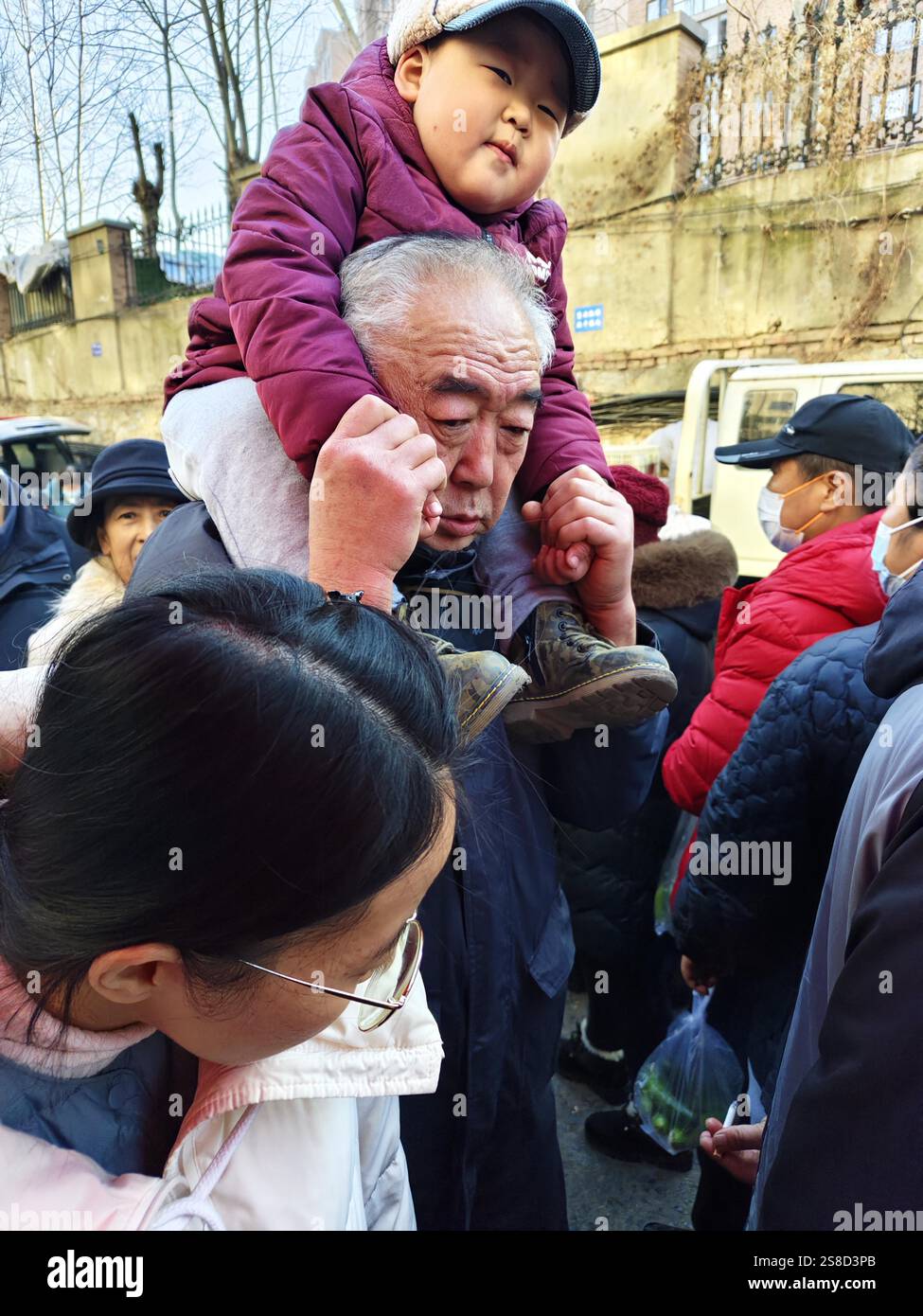 Spring In Dalian People buy Spring Festival goods at a market in Dalian City, northeast ...