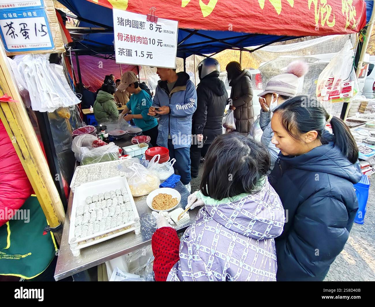 Spring In Dalian People buy Spring Festival goods at a market in Dalian City, northeast ...