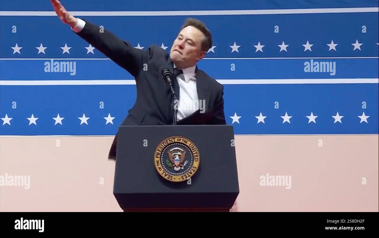 Elon Musk gestures while speaking at an indoor Presidential