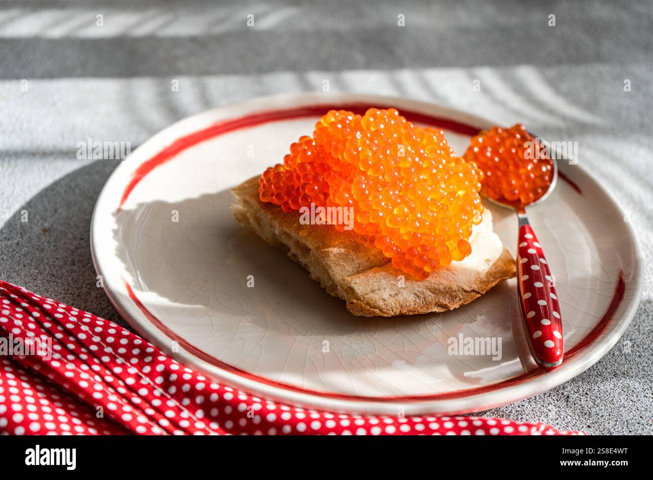 Top view of healthy organic red caviar from trout fish served on a ...
