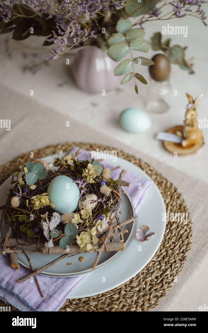 Top view of an Easter table setting featuring a plate with a rustic ...