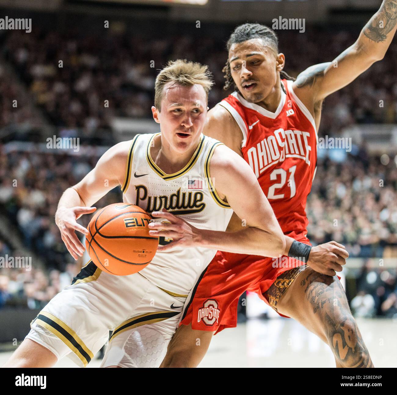 West Lafayette, Indiana, USA. 21st Jan, 2025. FLETCHER LOYER (2) of Purdue drives against Ohio State forward DEVIN ROYAL (21) during the NCAA menÃs basketball game between the Ohio Stat Buckeyes and the Purdue Boilermakers, Tuesday January 21, 2025, at Mackey Arena in West Lafayette, Ind. (Credit Image: © David Wegiel/ZUMA Press Wire) EDITORIAL USAGE ONLY! Not for Commercial USAGE! Stock Photo