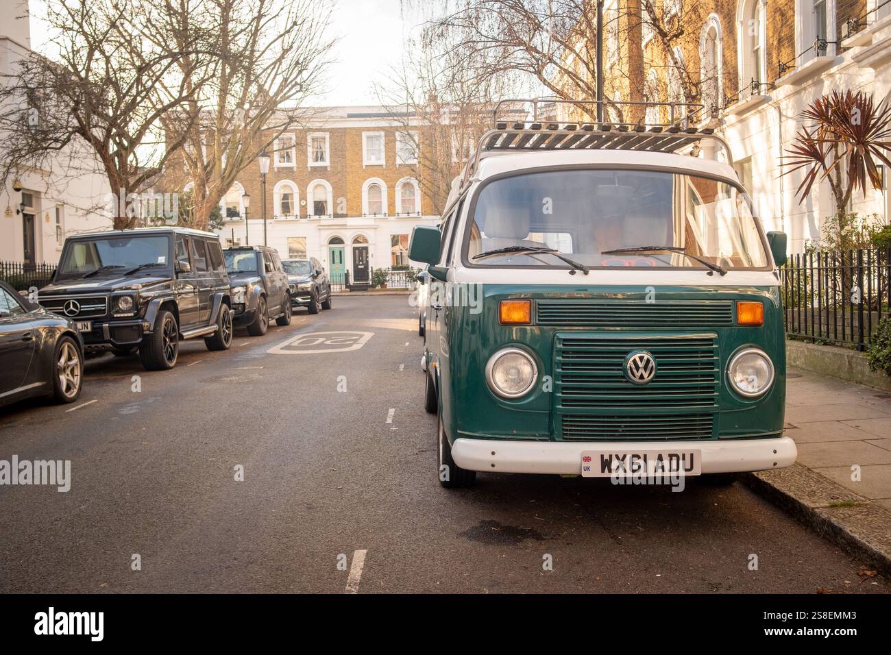 LONDON- JANUARY 14, 2025: Classic VW Camper Van parked on upmarket residential street in Chelsea Stock Photo