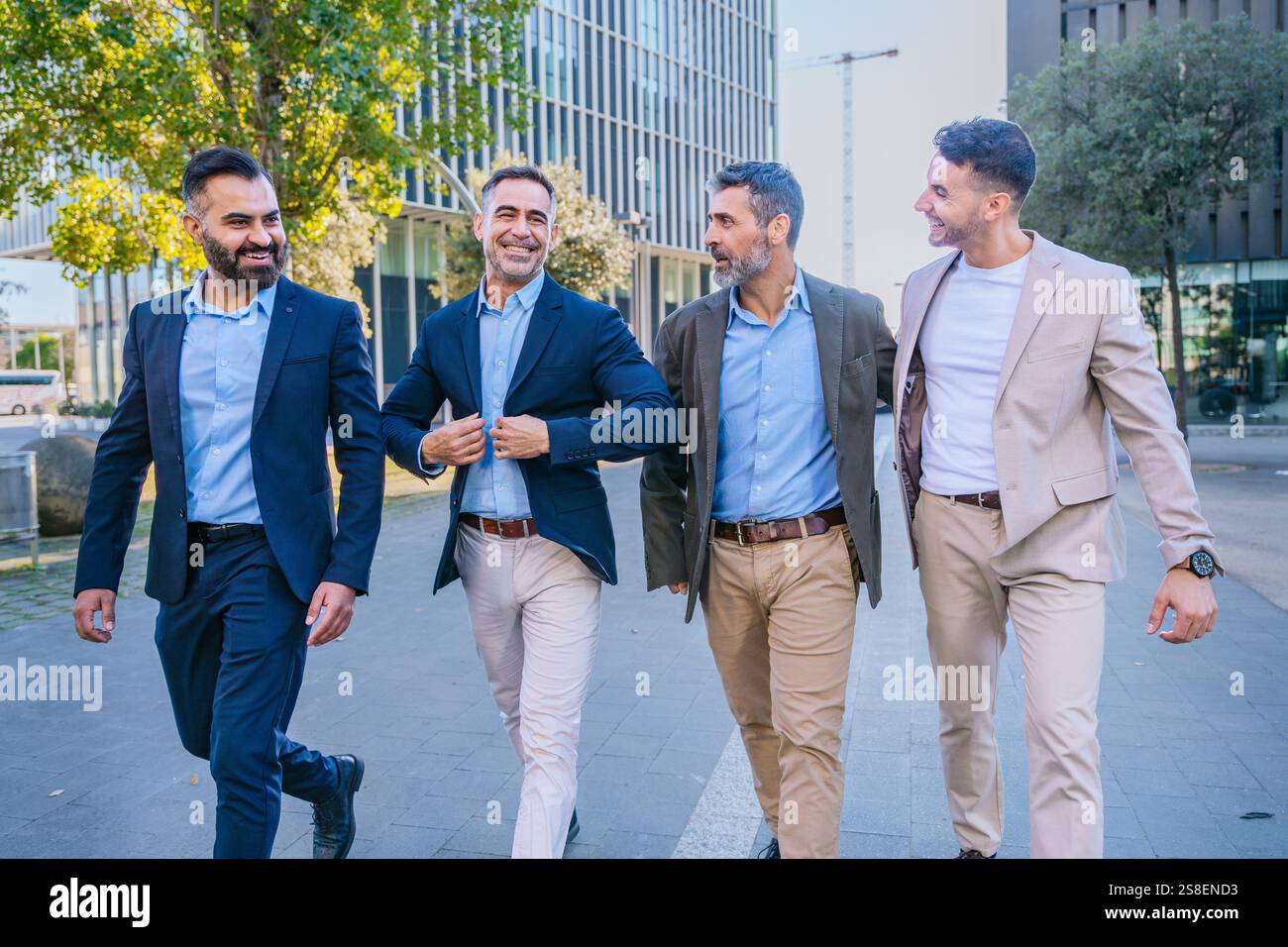Group of Businessmen Walking Together in Urban Setting Stock Photo - Alamy