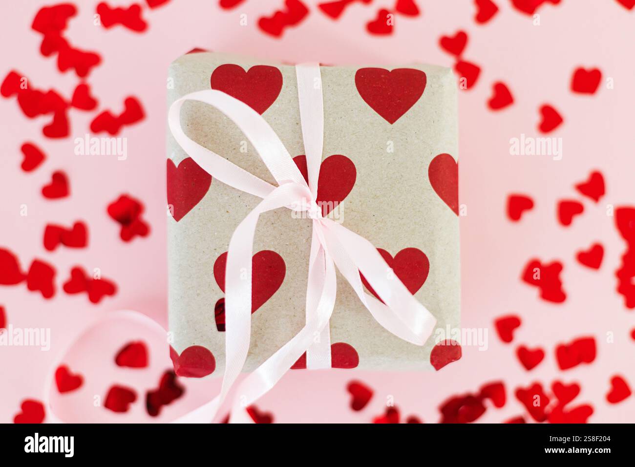 Valentines flat lay. Stylish gift box with red hearts and pink bow on ...