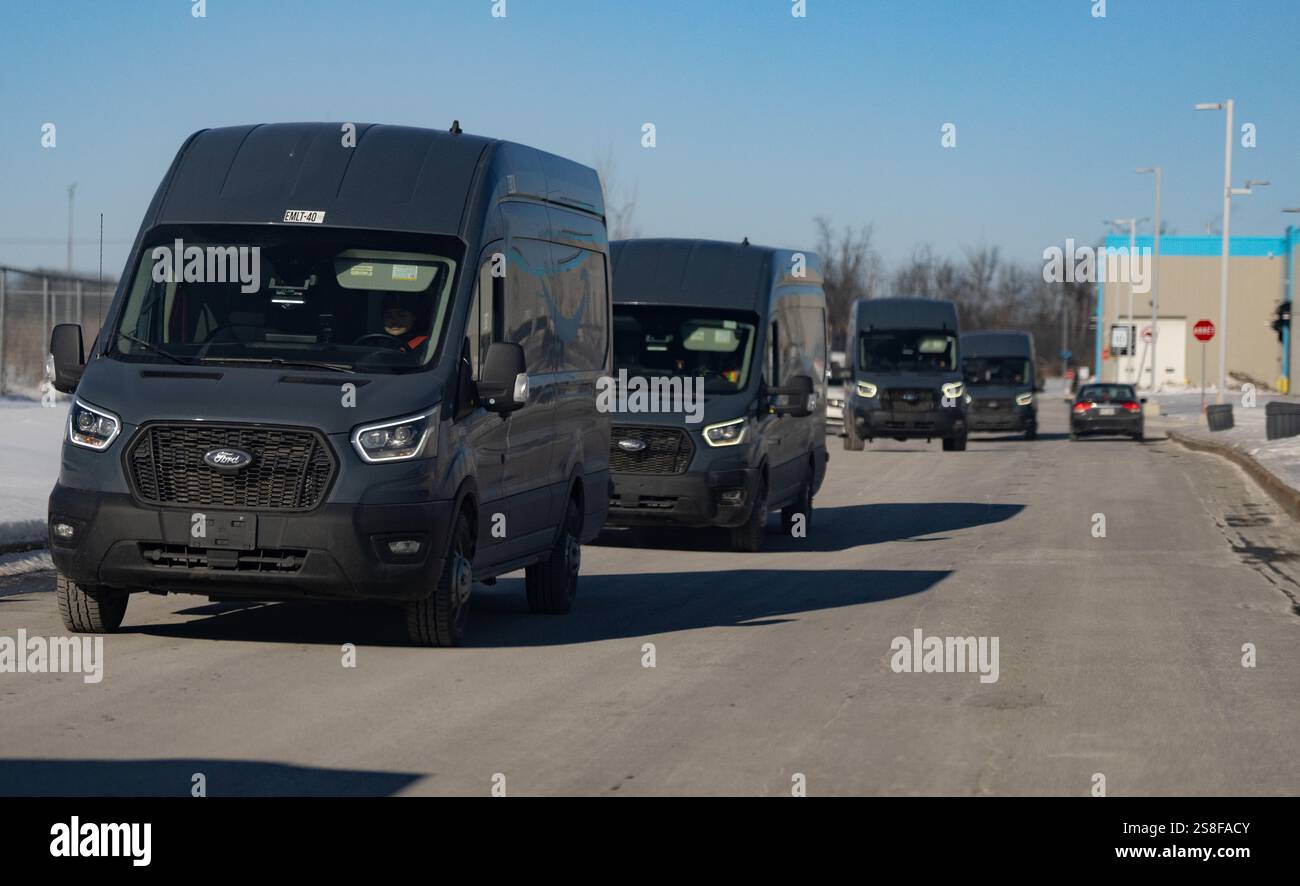 Laval, Canada. 22nd Jan, 2025. Delivery trucks leave Amazon's DXT4 ...