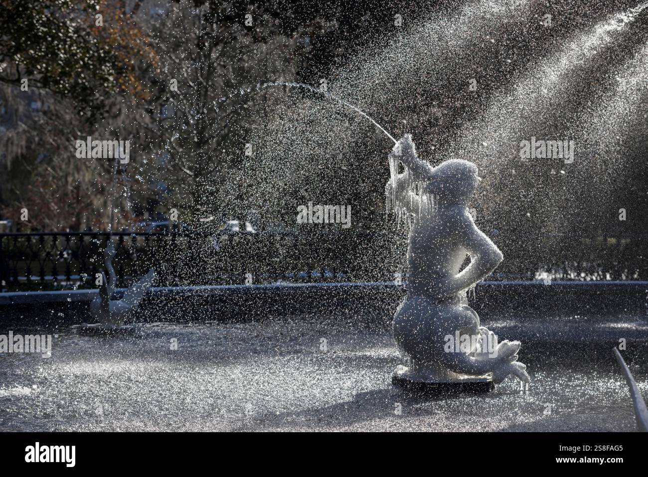 Ice clings to the cherub sculpture in the historic fountain at Forsyth