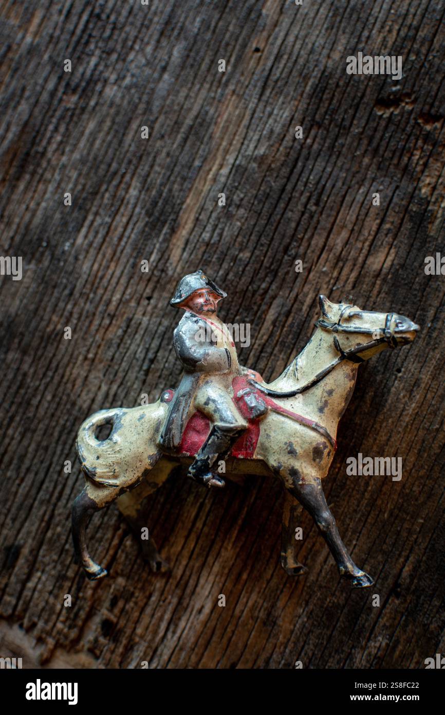 An antique figurine depicts a Napoleon representation riding a horse ...