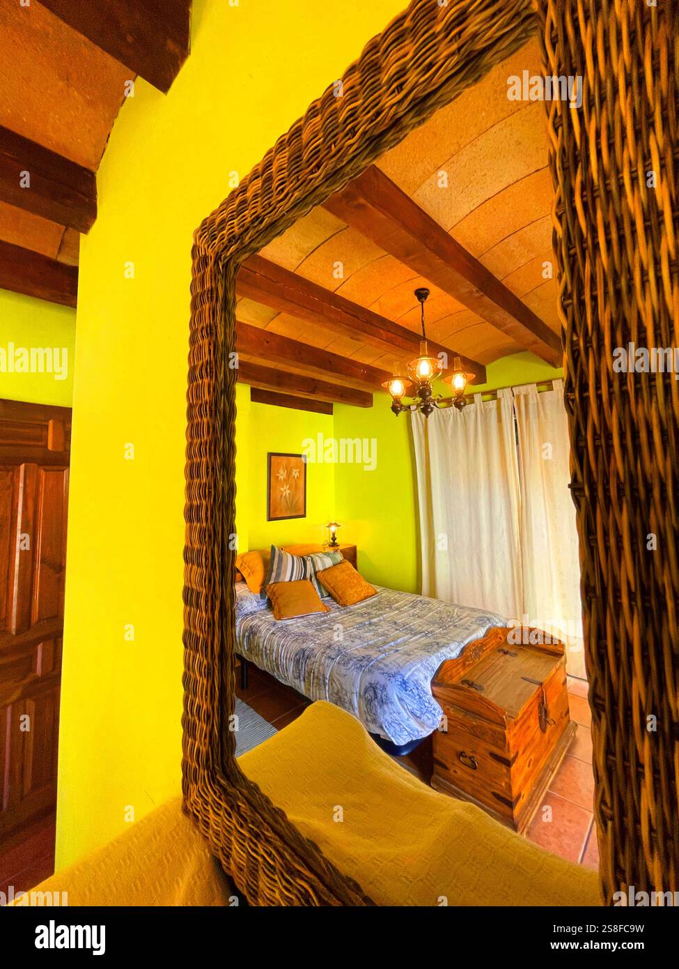 Bedroom of rural house reflected on mirror. - Smartphone Captured Stock Image