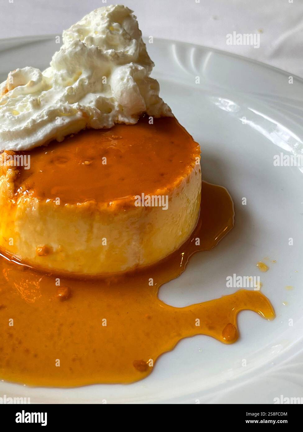 Creme caramel with cream. Spain. - Smartphone Captured Stock Image