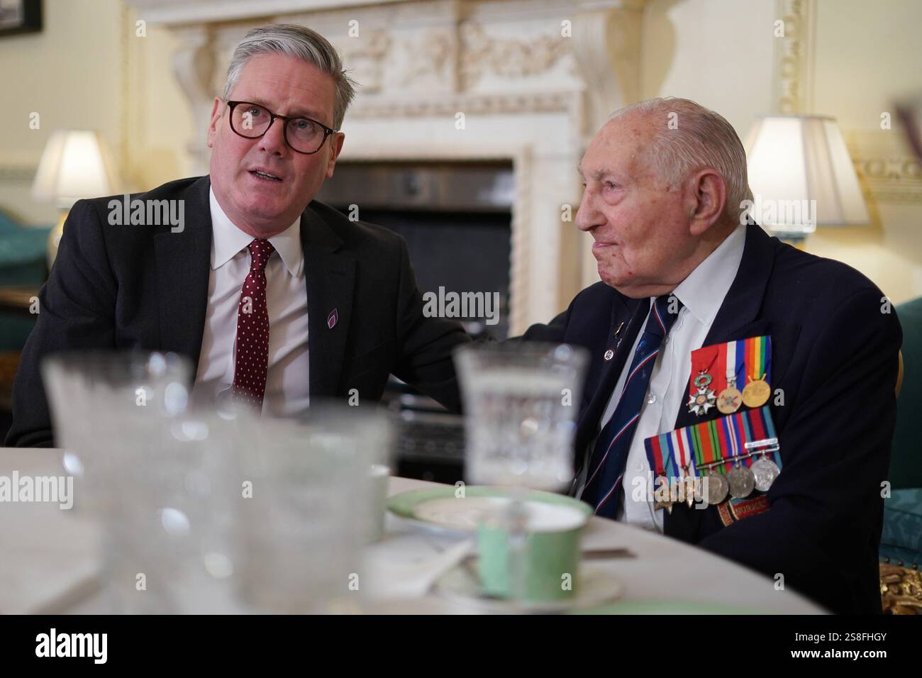 Prime Minister Sir Keir Starmer (left) speaking to speaks to WorldWar II veteran Mervin Kersh during a reception to mark Holocaust Memorial Day at 10 Downing Street, central London. Picture date: Wednesday January 22, 2025. Stock Photo